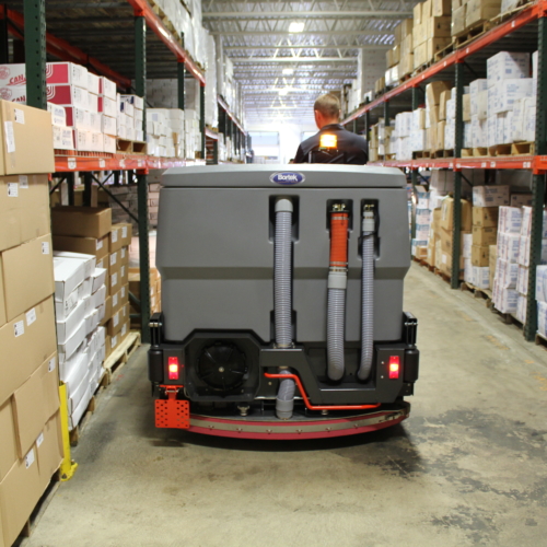 PowerBoss Nautilus scrubbing warehouse aisle