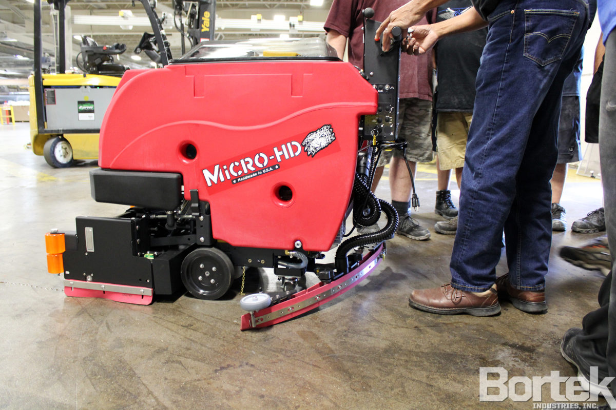 Factory Cat Micro-HD floor scrubber in use