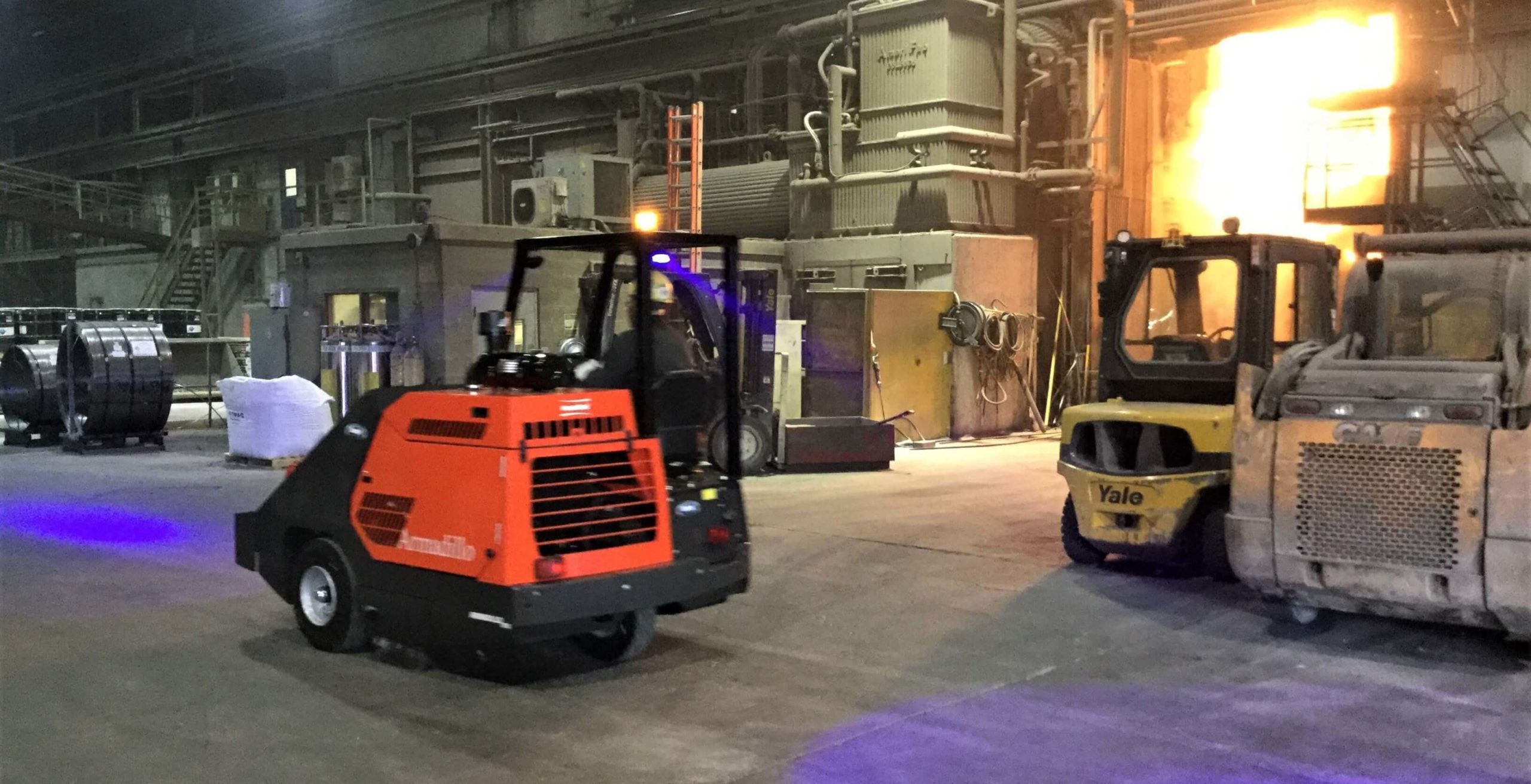 PowerBoss Armadillo 10X ride-on floor sweeper with enclosed cab