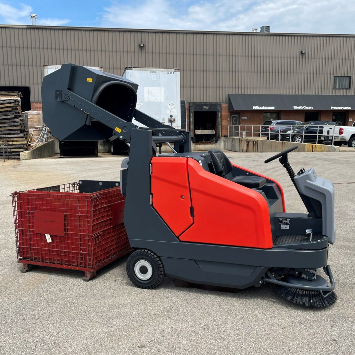 PowerBoss Sweepmaster 1500RH high dumping into a bin