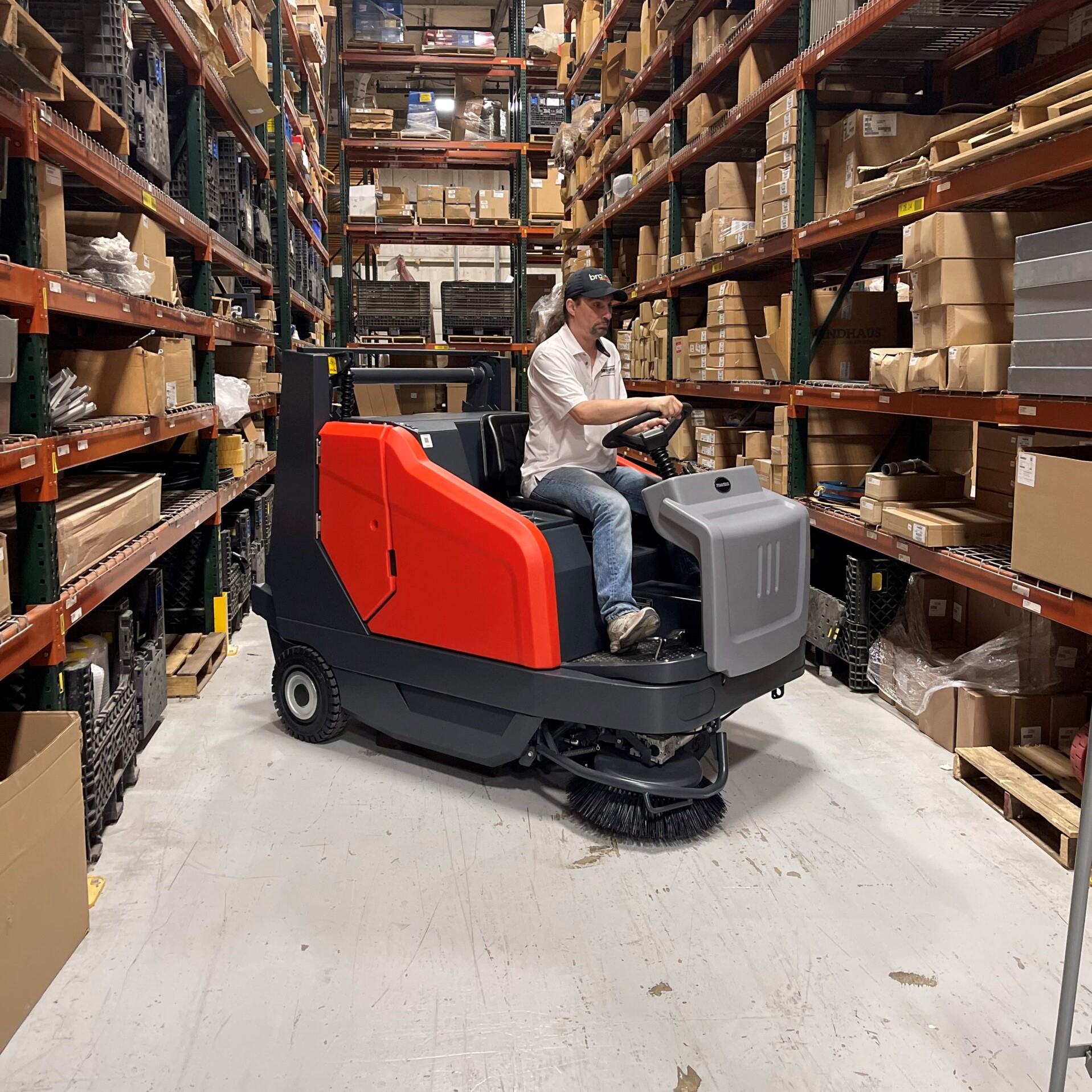 PowerBoss Sweepmaster 1500RH turning in a warehouse aisle