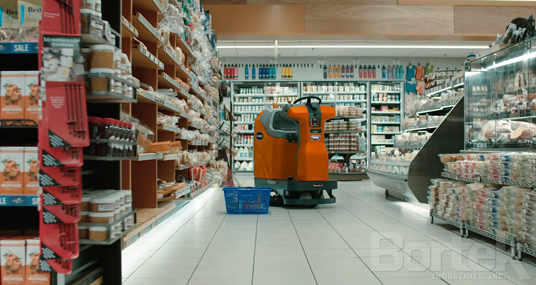 PowerBoss ScrubMaster AMR autonomous floor scrubber operating in a grocery store retail environment