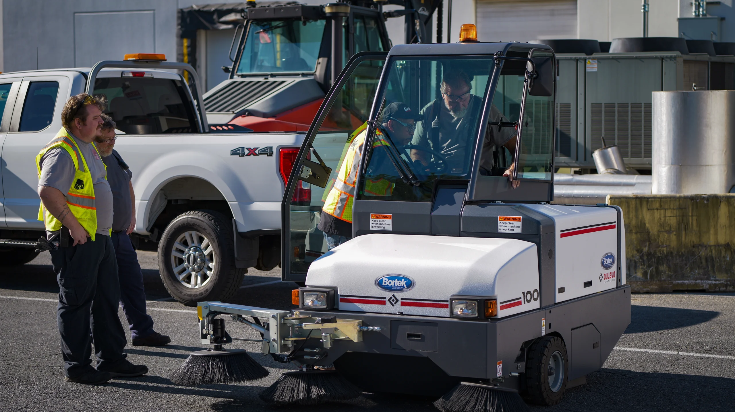 Dulevo large ride-on floor sweeper during demo
