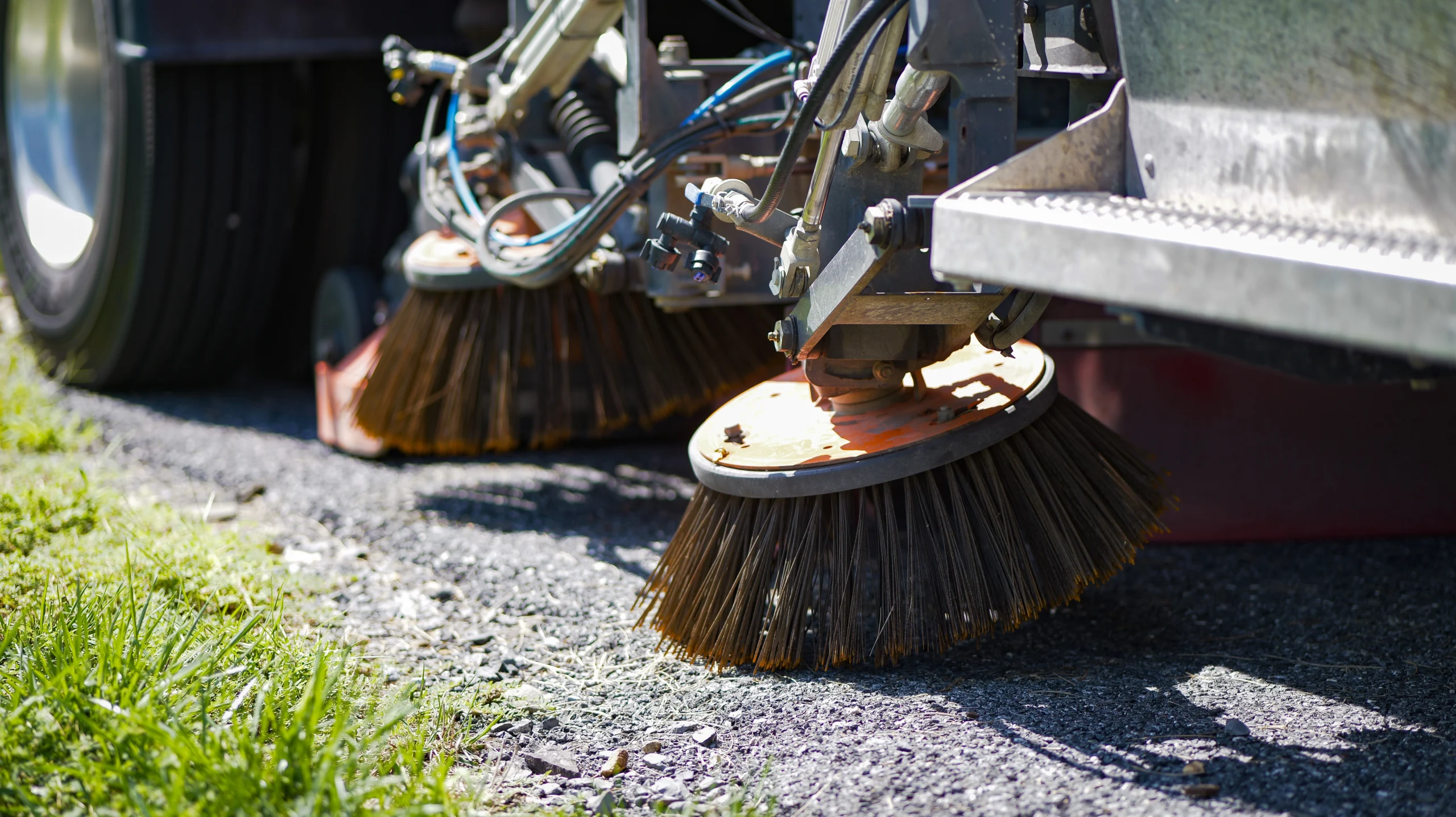 Close-up of Scarab street sweeper broom system