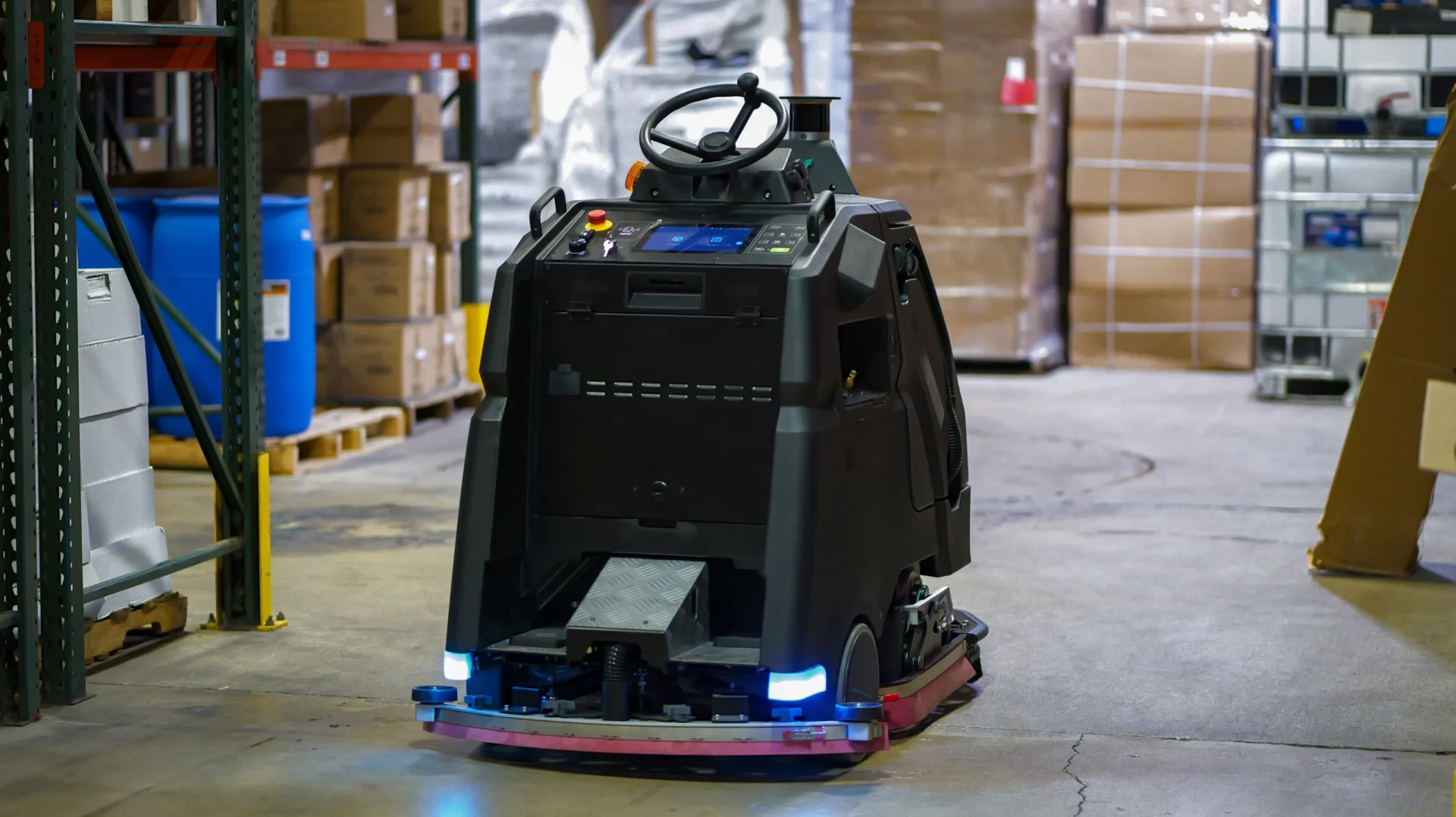 Big Ox Ai-32 autonomous floor scrubber, rear view, in a warehouse aisle